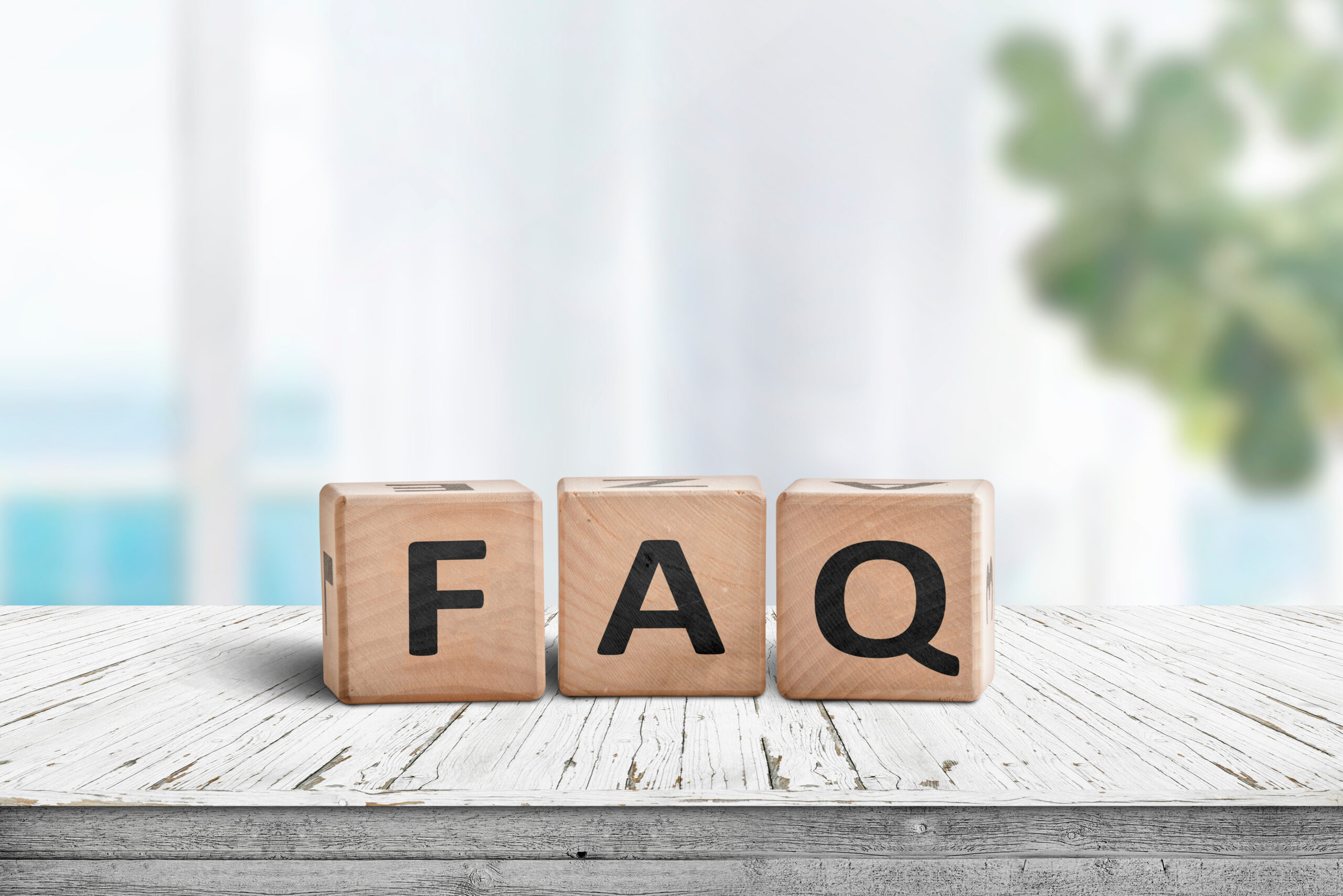 three blocks saying F, A, Q, which stands for frequently asked questions 